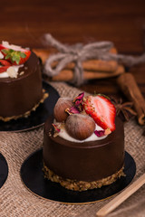 Cake close-up on burlap. Dessert with strawberries and nuts. Cupcake.