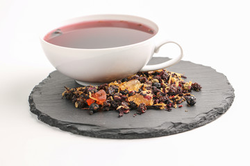 Still life, aromatic dry tea with fruits and petals