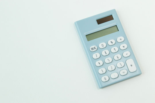 blue calculator white background  image close up.