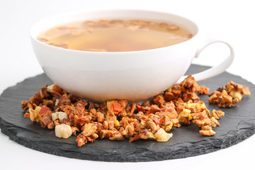 Still life, aromatic dry tea with fruits and petals