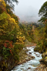Autumn river valley close to Moxizhen in Sichuan, China 