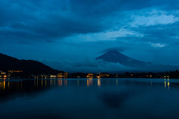 KAWAGUCHIKO, JAPAN A cloud-free view of Mount Fuji at night, from across Lake Kawaguchi.