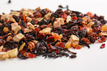 Still life, aromatic dry tea with fruits and petals