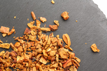 Still life, aromatic dry tea with fruits and petals