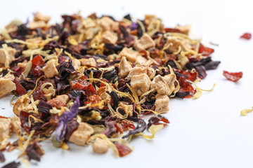 Still life, aromatic dry tea with fruits and petals