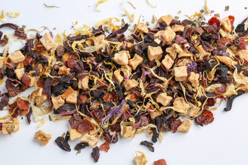 Still life, aromatic dry tea with fruits and petals