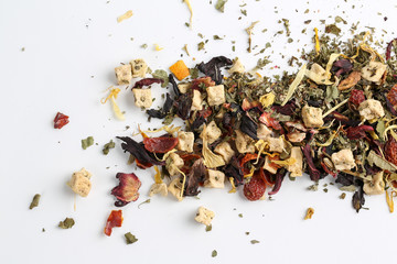 Still life, aromatic dry tea with fruits and petals
