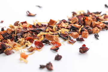 Still life, aromatic dry tea with fruits and petals