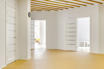 empty hallway with open doors in modern kindergarten
