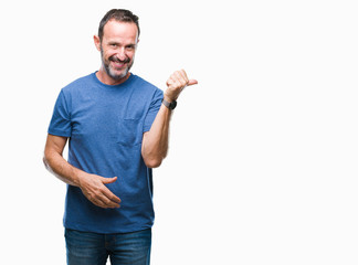Middle age hoary senior man over isolated background smiling with happy face looking and pointing to the side with thumb up.