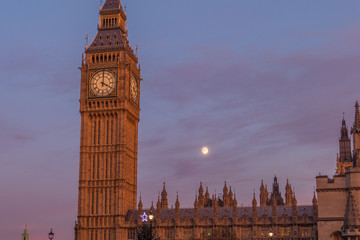 Big Ben Tower And House Of Parliament Over A Moon At Beautiful Sunset