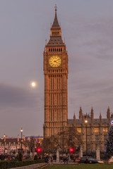 Big Ben Tower And House Of Parliament Over A Moon At Dusk.