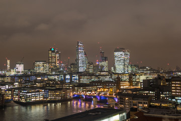 Fototapeta na wymiar Colorful Business Center Cityscape With View Of River Thames In London, UK At Night.