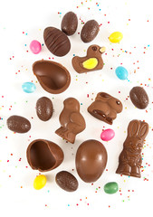 Easter composition with chocolate eggs and animals isolated on white