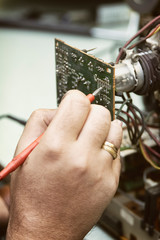 Fototapeta premium Fixing The Components Of A Tube Television