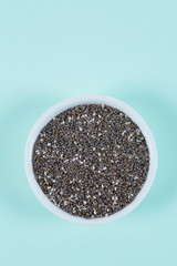 chia seeds on turquoise surface