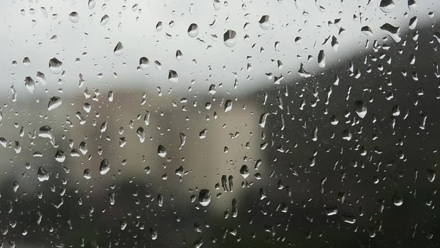 Rain water drops on the window. Footage
