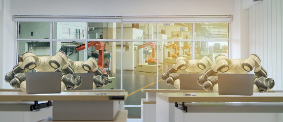 iot smart factory in industry 4.0 robot technology concept, engineer , business man using futuristic tablet to control ,monitor, management robotic to improve efficiency, product, quality, reduce cost