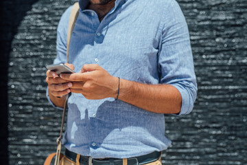 Fototapeta premium Businessman Typing on Samrtphone