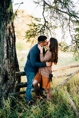 photo shoot of a beautiful brunette and her boyfriend in nature