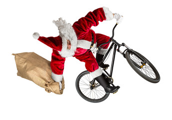 crazy santa claus jump on dirt mountain bike with jute burlap bag isolated abstract christmas funny...