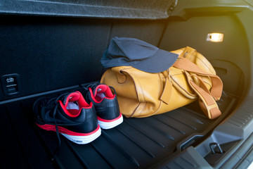 Bag and shoe in the trunk of a car. Preparation for the trip.  © bennnn