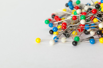 Colorful pushpins on a white board. School or business concept
