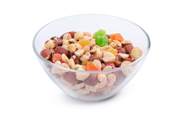 Bowl of nuts and candied fruits isolated on white background