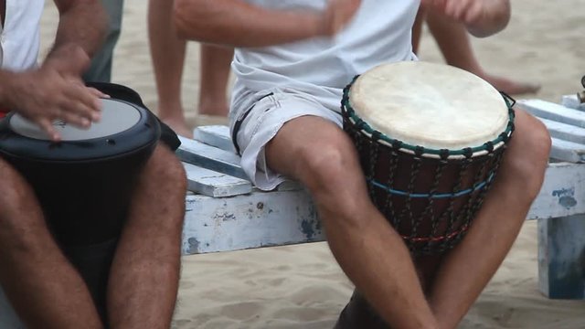 Unidentified man playing on drum 