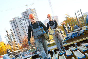 construction workers at building area installing wormwork