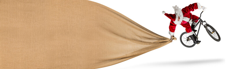 crazy santa claus jump on dirt mountain bike with big huge red bag copy space isolated white banner background