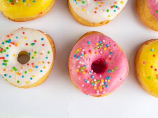 Сolored donuts, flat lay, copy space