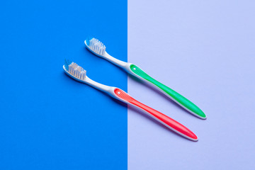 Flat lay composition with manual toothbrushes on color background, close up