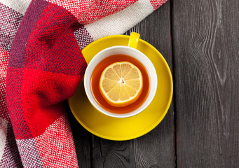 Cup of tea with lemon on table