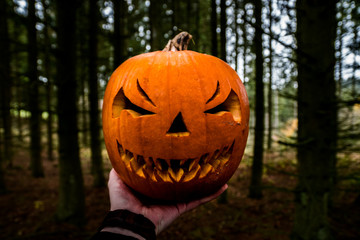 scary halloween pumpkin in the hand