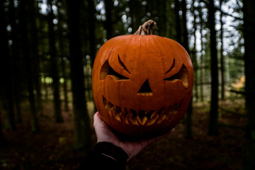 scary halloween pumpkin in the hand