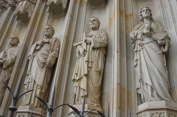 Fototapeta premium Sculptures on the facade of Barcelona Cathedral, located in Gothic Quarter in rainy morning