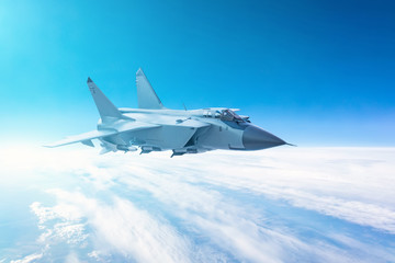 Fototapeta na wymiar Fighter jet flying with a blue sky background.