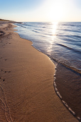beautiful golden sunset over the sea and the beach