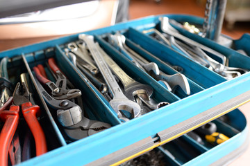 Closeup open tool cabinet with tools for repair in a car repair shop // Closeup offener...
