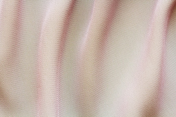 pink fabric with large folds, abstract background