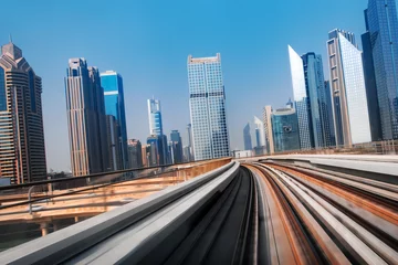 Gordijnen View from first railway carriage. Speed motion blur metro abstract background in the day © Ivan Kurmyshov