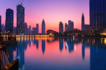 Fotobehang Beautiful view to Dubai city skyline downtown in the dusk, UAE © Ivan Kurmyshov