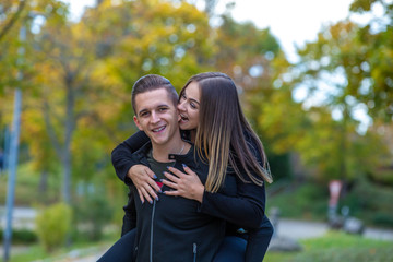 Young couple in love walking in the autumn park