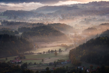 Sunrise in Rudawy Janowickie at foggy morning, Silesia, Poland