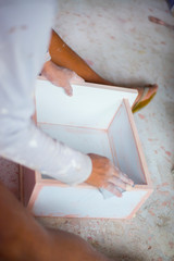 Wood furniture artisans are working.