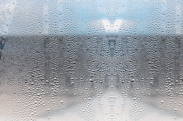 Window with condensate or steam after heavy rain, large texture or background