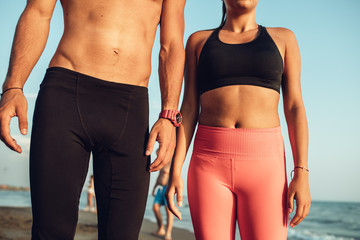 Sportspeople Training by the Sea