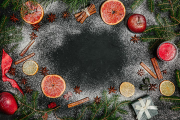White Christmas background with empty copy space. Cinnamon, dried grapefruit as a decorative frame for the concept of xmas or xmas card