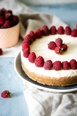 Cake with raspberries and curd cheese. Homemade cream and berry cheesecake